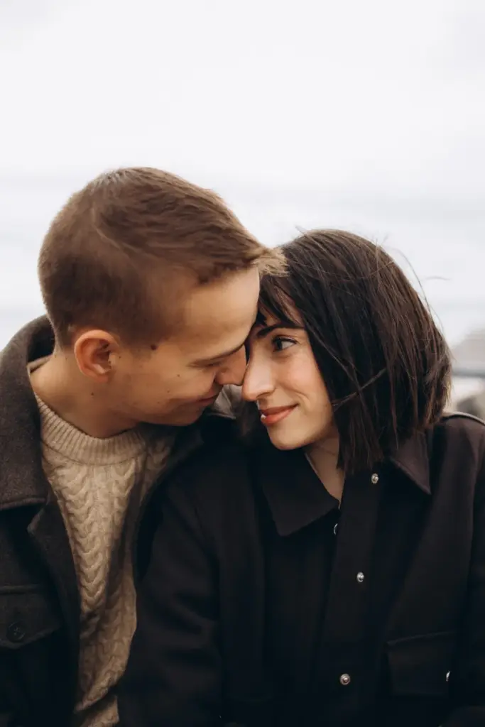 Close portrait of a couple on a grey winter day in Lisbon