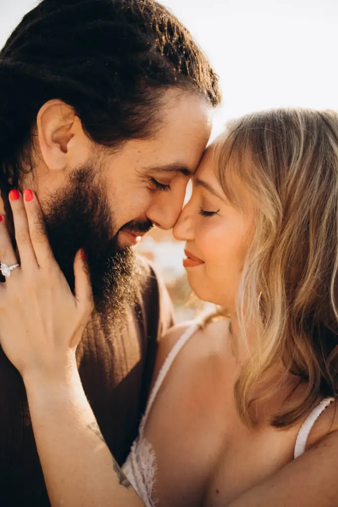 Couple forehead to forehead in a close portrait in Lisbon