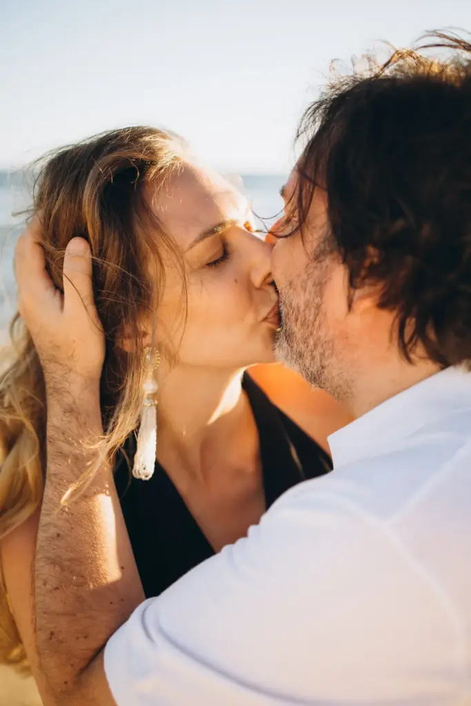 Couple kissing on the beach near Lisbon