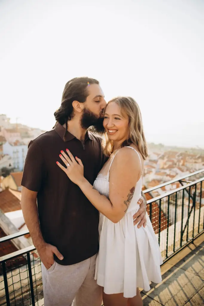 Couple laughing together at an Alfama viewpoint