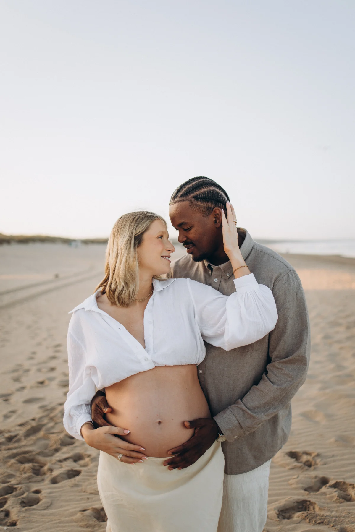 Maternity portrait of a couple on an Atlantic beach
