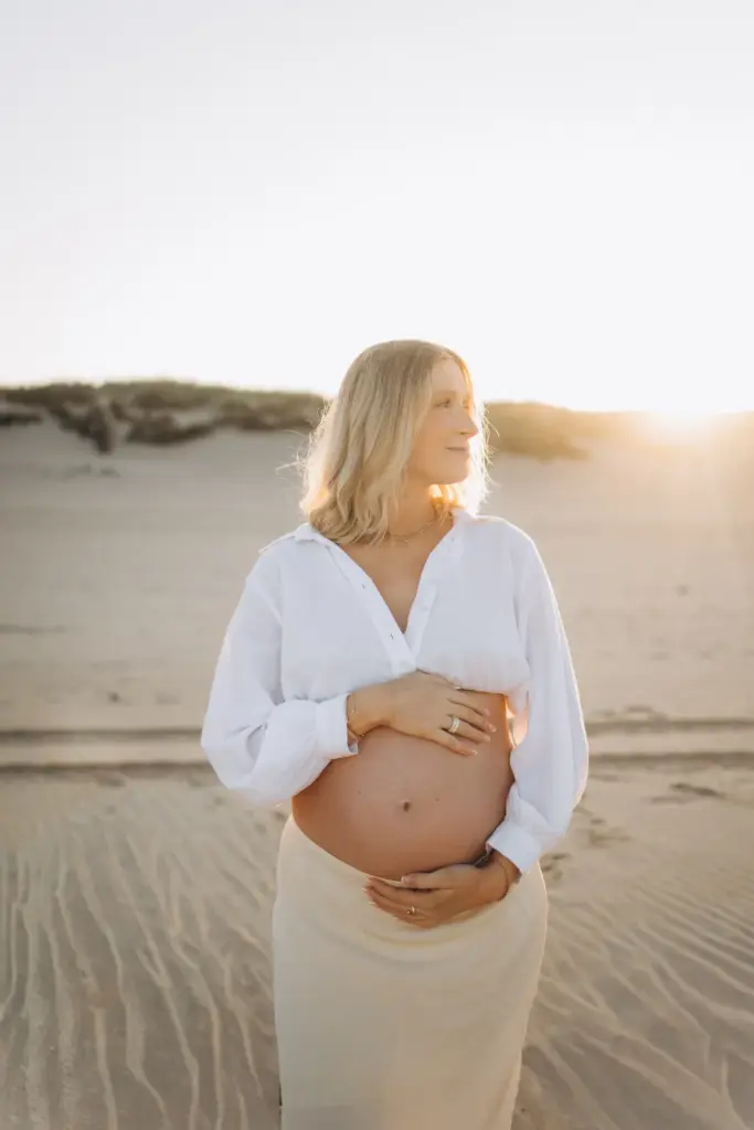 Pregnant woman in the dunes near Lisbon