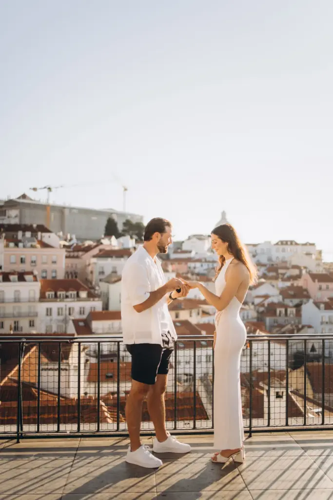 Proposal moment at the Portas do Sol viewpoint above Alfama
