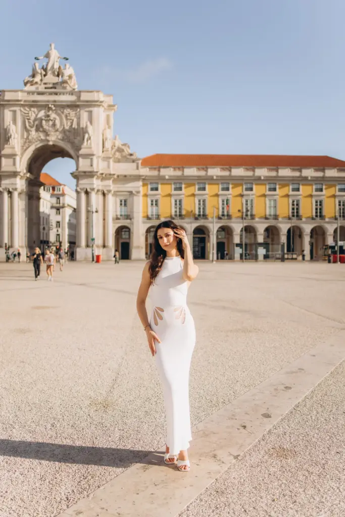 Woman showing her engagement ring at Praça do Comércio after the proposal