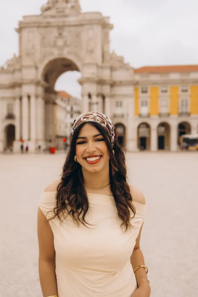 Smiling portrait of a woman at Praça do Comércio