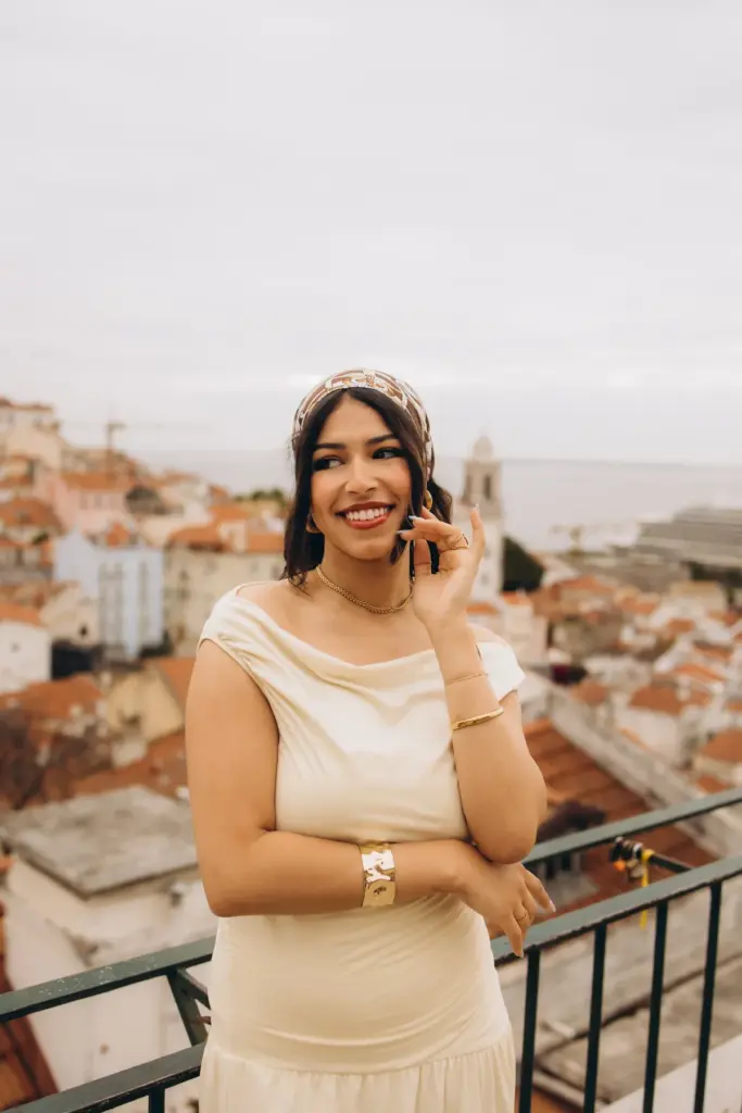 Woman laughing above the rooftops of Alfama