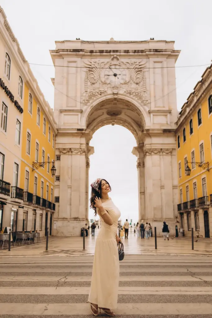 Woman in front of the Rua Augusta Arch in Lisbon