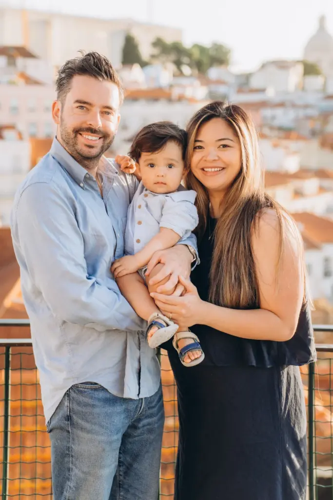 Family with a toddler at an Alfama viewpoint, mum expecting their second child
