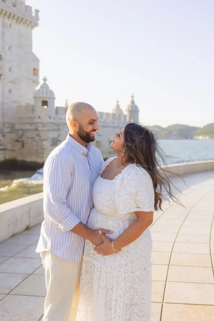 Couple about to kiss on the riverside walk at Belém