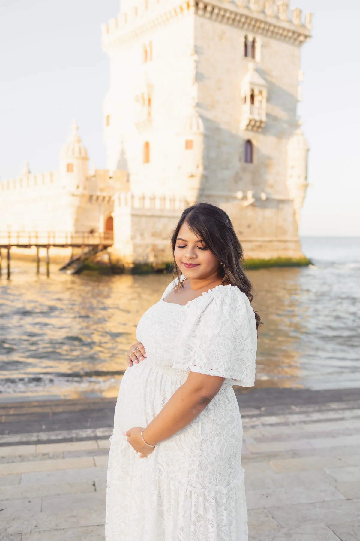 Woman in a white dress by Belém Tower